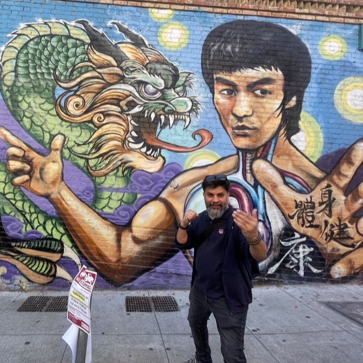 In front of the Bruce Lee mural in San Francisco Chinatown